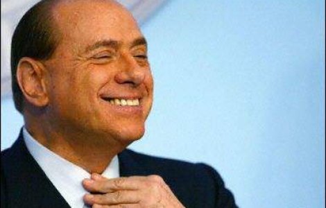 Berlusconi isi aranja intalniri amoroase in cursul unei reuniuni cu Tariceanu