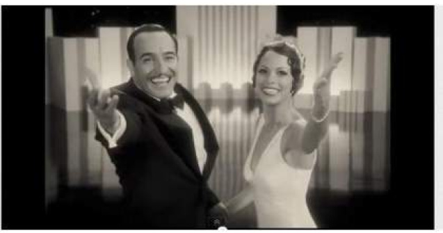 Uggie, cainele din filmul "The Artist", isi "scrie" memoriile