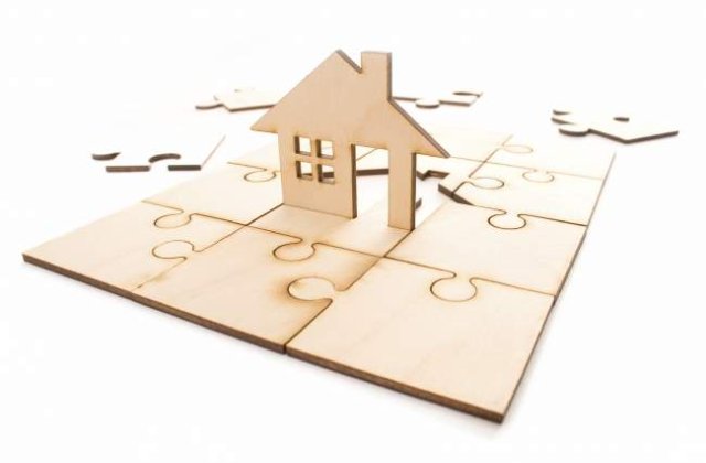 Guvern: Restituirea imobilelor s-a transformat intr-o mare afacere imobiliara