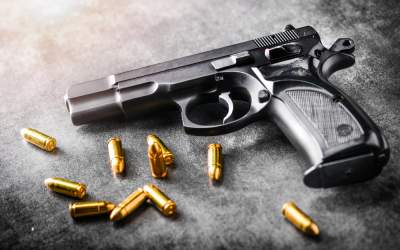 O armă cu gloanțe a fost...