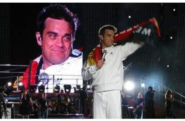 Robbie Williams vrea sa adopte doi copii din Haiti