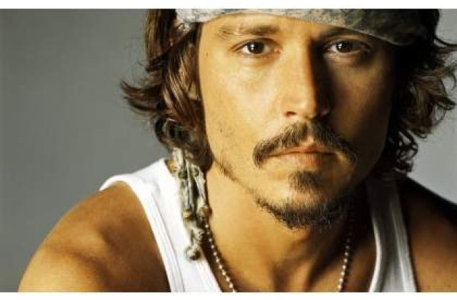 Johnny Depp s-a logodit cu Amber Heard