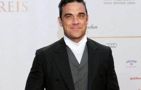 Robbie Williams intentioneaza sa revina in grupul Take That