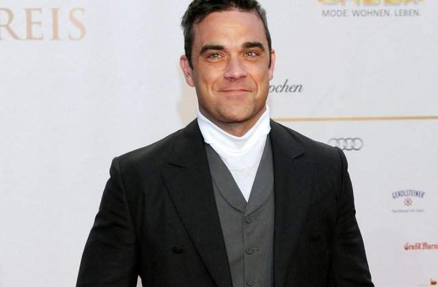 Robbie Williams intentioneaza sa revina in grupul Take That
