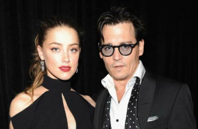 Actorii Johnny Depp si Amber Heard au ajuns la o intelegere privind divortul